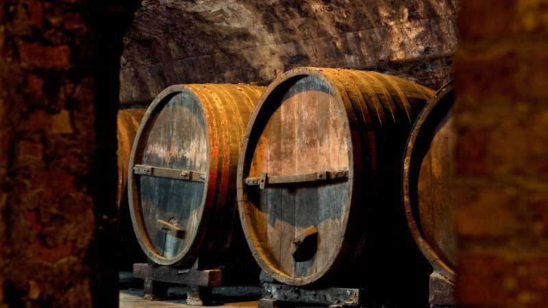Old barrels in underground cellar.